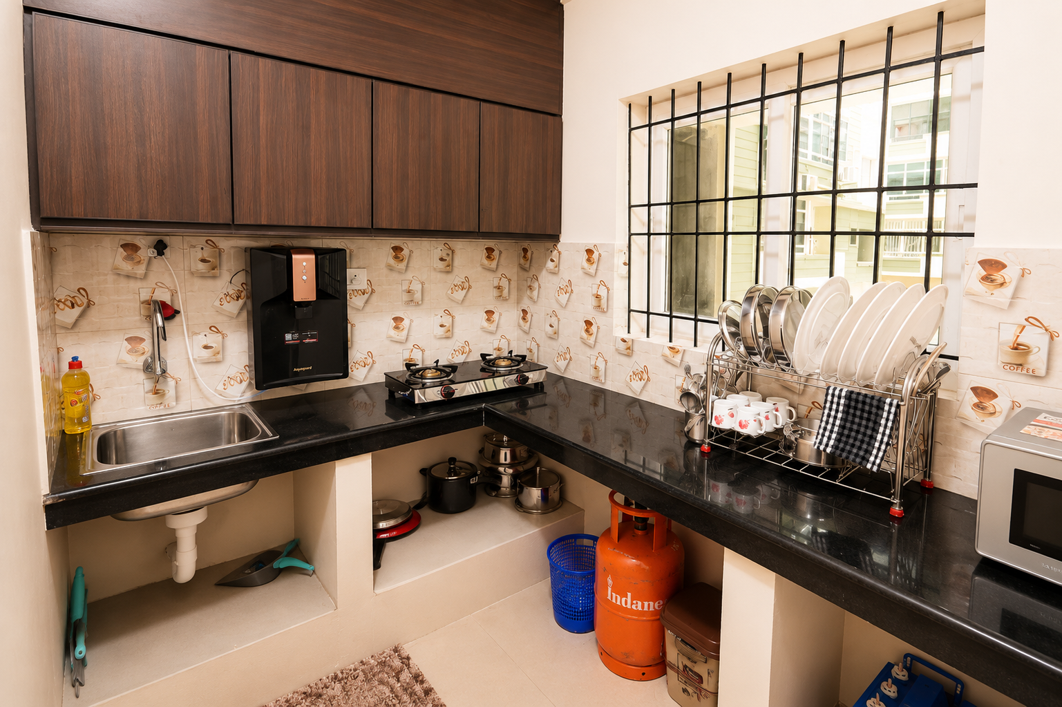 Fully equipped self-cooking kitchen at Hima Havens Guruvayur Homestay
